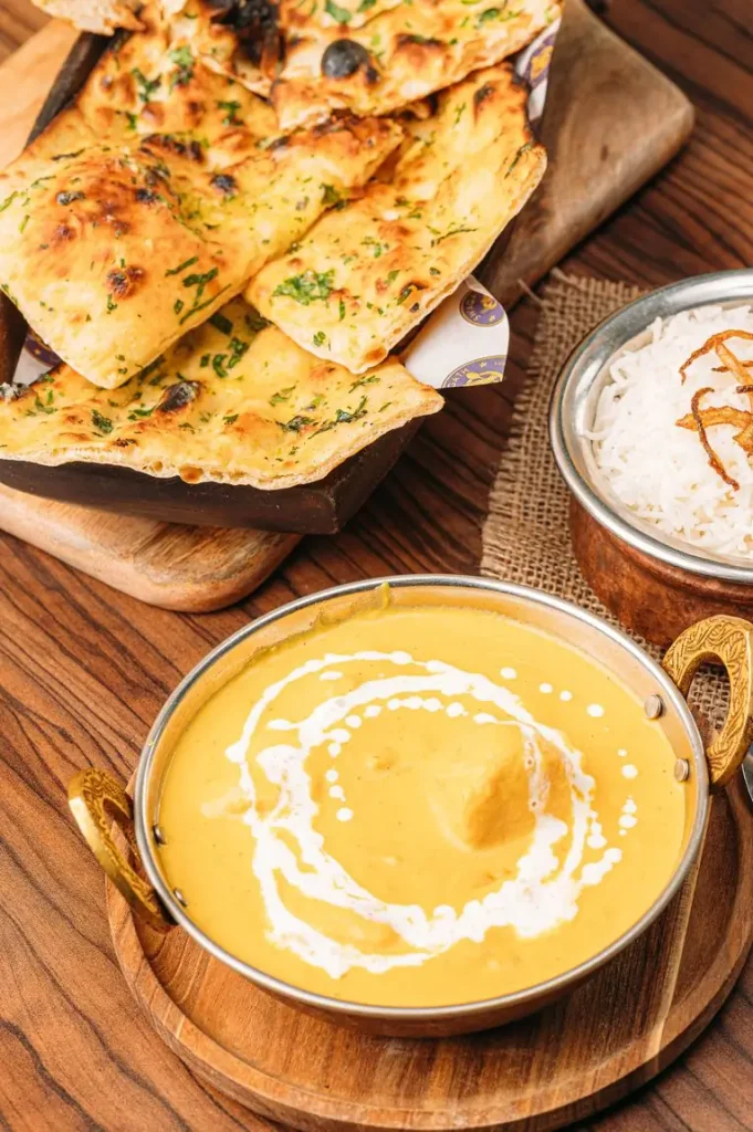 Creamy korma with naan bread and basmati rice