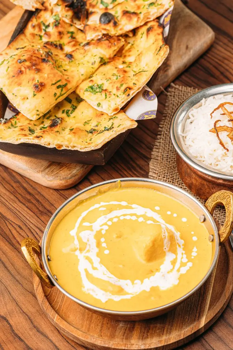 Creamy korma with naan bread and basmati rice