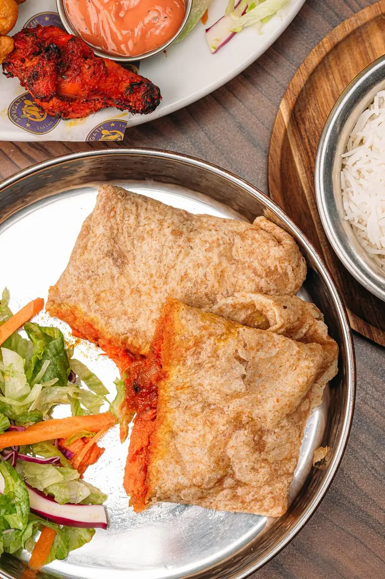 Puri bread with a spiced filling, served with salad