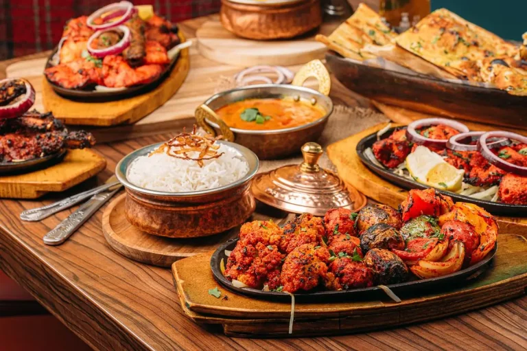 A table of tandoori sizzlers, pakora, curries and rice
