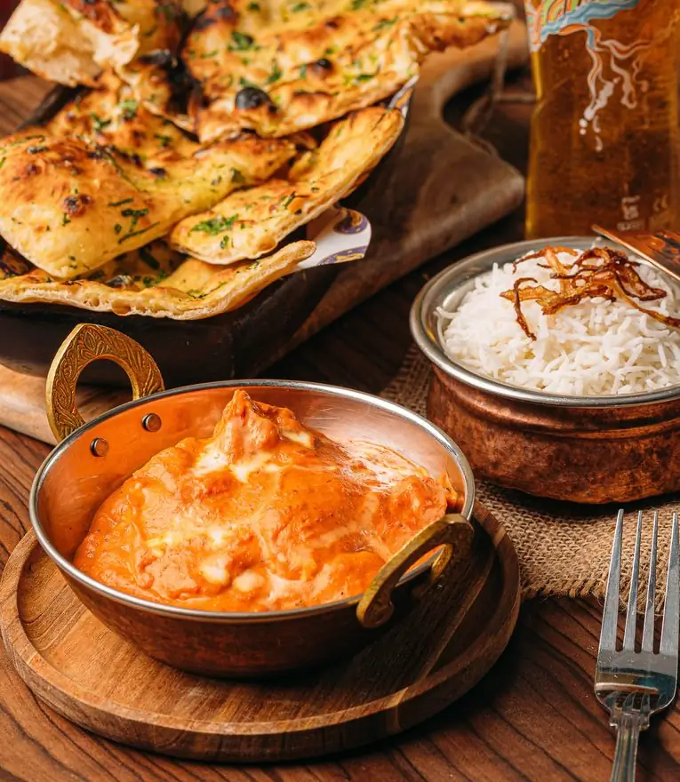 Tikka masala with garlic naan and basmati rice